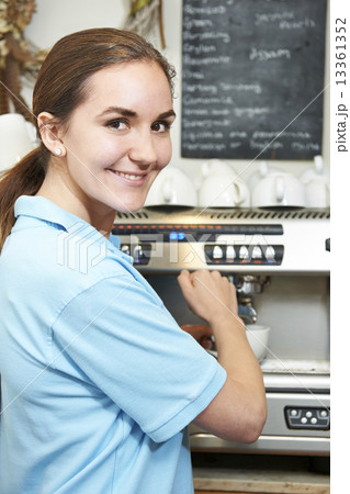 Woman In Cafe Making Cup Of Coffee 13361352