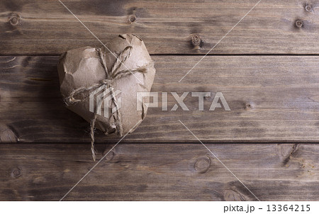Heart wrapped in brown kraft paper 13364215