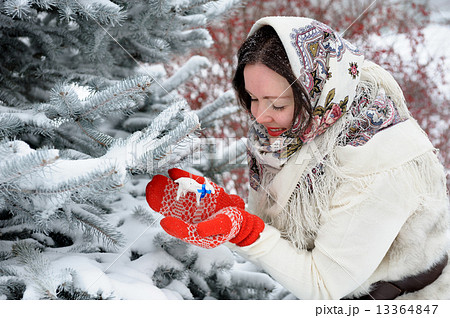 Young Russian woman in winter park Young Russian woman in winter park 13364847