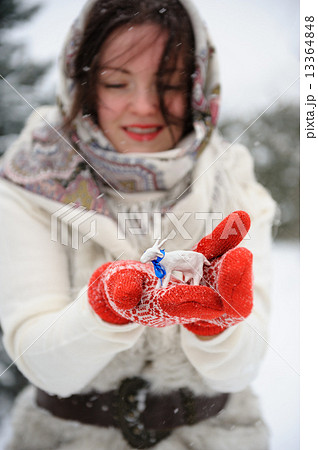 Young Russian woman in winter park Young Russian woman in winter park 13364848