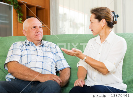 mature couple having serious talking 13370441