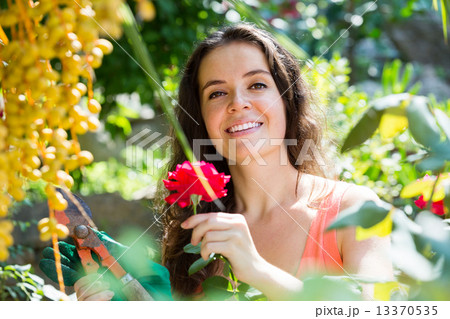 Happy woman in gardening Happy woman in gardening 13370535