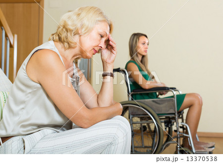 Woman and handicapped female having quarrel 13370538