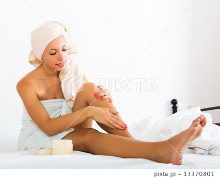 Young woman caring for legs Young woman caring for legs 13370801