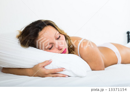 Middle-aged woman sleeping 13371154