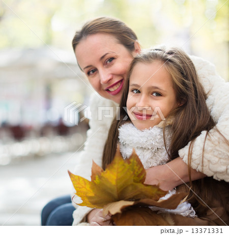 happy woman with little daughter happy woman with little daughter 13371331
