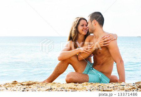 young lovers at sandy beach 13371486