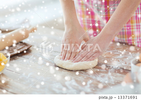 close up of female hands kneading dough at home close up of female hands kneading dough at home 13371691
