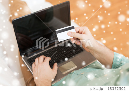 close up of man with laptop and credit card 13372502