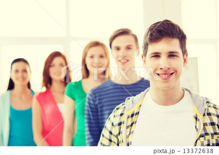 smiling male student with group of classmates 13372638