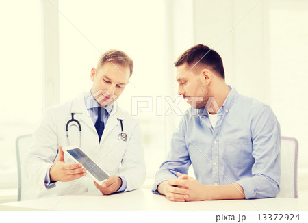 doctor with tablet pc and patient in hospital doctor with tablet pc and patient in hospital 13372924