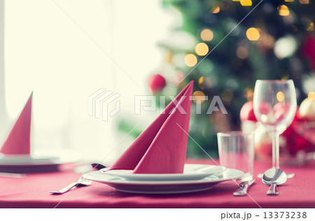 room with christmas tree and decorated table 13373238