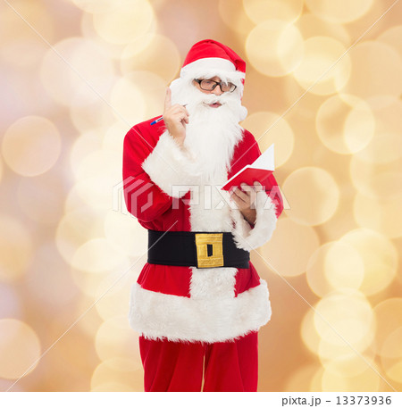 man in costume of santa claus with notepad man in costume of santa claus with notepad 13373936