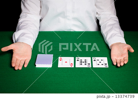 holdem dealer with playing cards 13374739