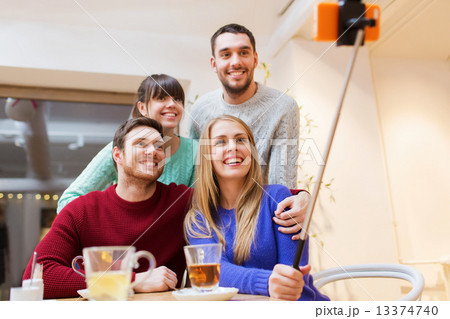 group of friends taking selfie with smartphone 13374740