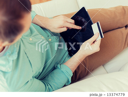 close up of man with laptop and credit card 13374779