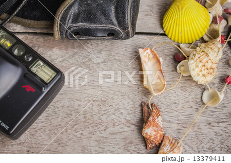 Cameras and shells on wooden Cameras and shells on wooden 13379411