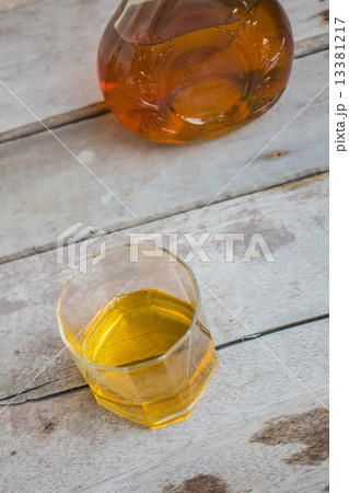Whiskey glass on a table. Whiskey glass on a table. 13381217