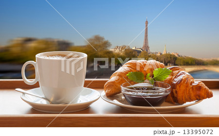 Coffee with croissants against Eiffel Tower in Paris, France Coffee with croissants against Eiffel Tower in Paris, France 13395072