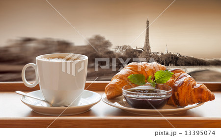 Coffee with croissants against Eiffel Tower in Paris, France Coffee with croissants against Eiffel Tower in Paris, France 13395074