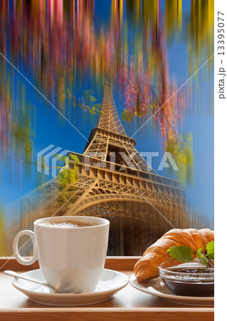 Coffee with croissants against Eiffel Tower in Paris, France Coffee with croissants against Eiffel Tower in Paris, France 13395077