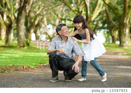 Chinese granddaughter and grandfather in the park Chinese granddaughter and grandfather in the park 13397935