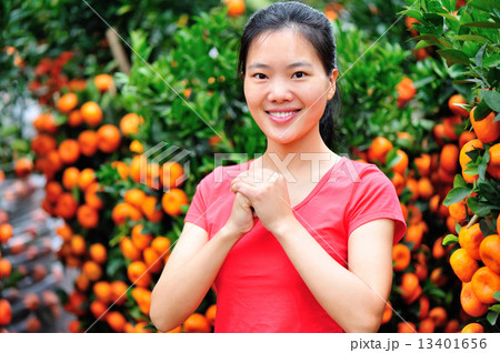 young asian woman wishing you a happy chinese new year young asian woman wishing you a happy chinese new year 13401656