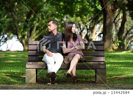 1 chinese couple having an argument in a park 13442684
