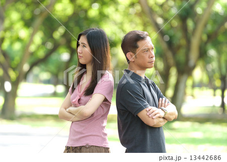 1 chinese couple having an argument in a park 1 chinese couple having an argument in a park 13442686