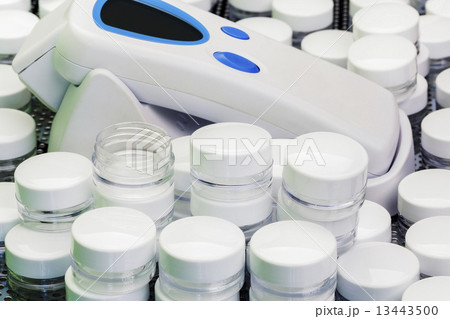 Emty skin cans with skin measure device in background  13443500