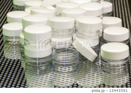 Empty skin cans with white caps 13443501
