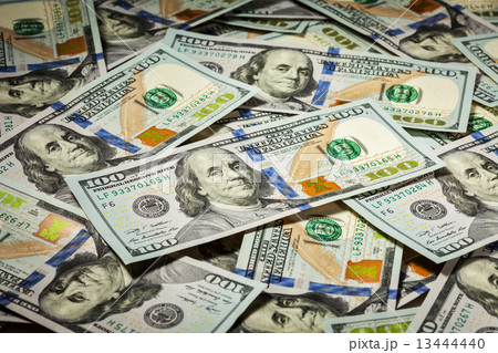 Background of hundred dollars bank notes 13444440