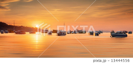 sunrise with colorful sky and boats on the beach sunrise with colorful sky and boats on the beach 13444556