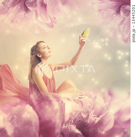 花の妖精と蝶々の写真素材