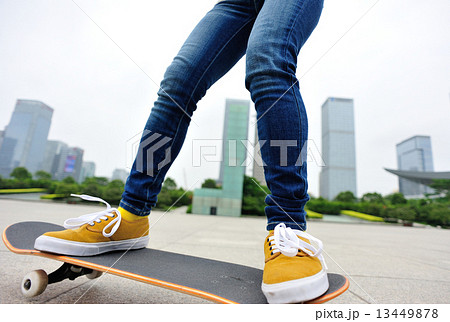 woman skateboarder skateboarding at sunrise city woman skateboarder skateboarding at sunrise city 13449878