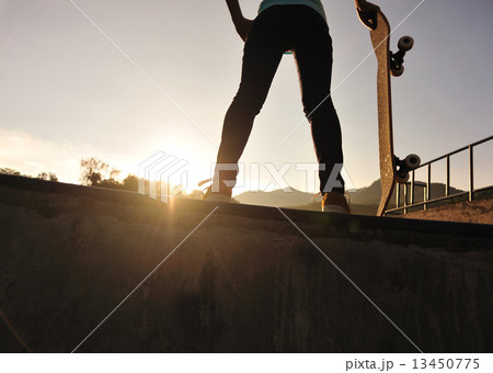 skateboarding woman sunrise  13450775