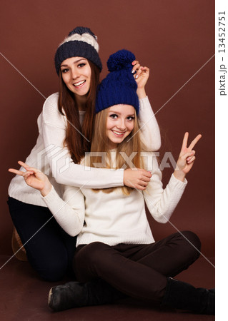 Two teenager girls friends in winter clothes  13452751
