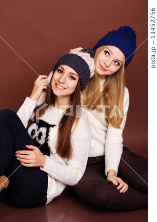 Two teenager girls friends in winter clothes  13452756