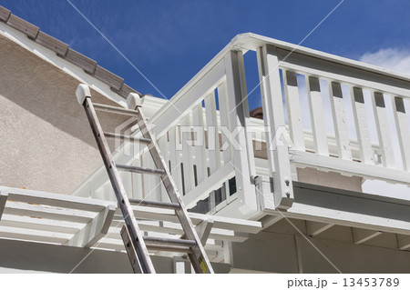 Construction Ladder Leaning on White House Deck 13453789