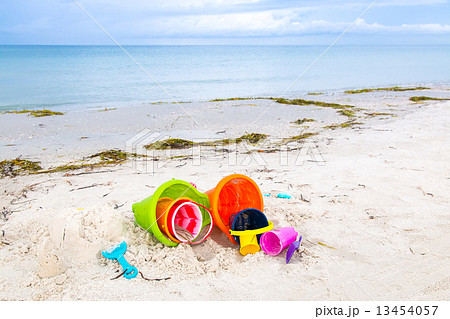 Plastic children toys on the sand beach 13454057