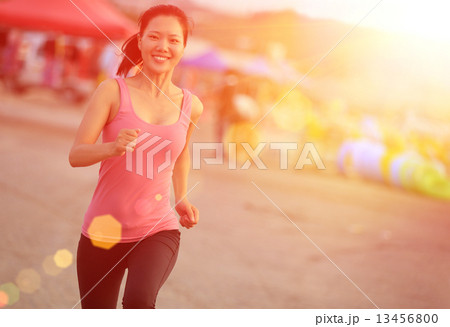 healthy lifestyle beautiful asian woman running at beach  13456800
