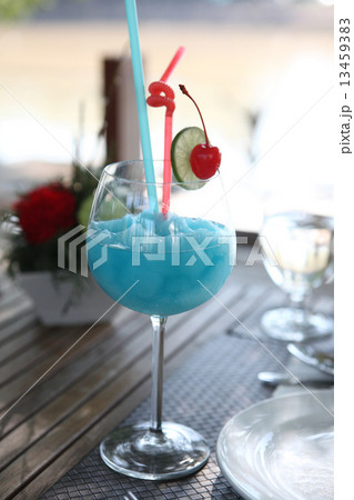 Blue cocktail with cherry and lime , kamikaze 13459383