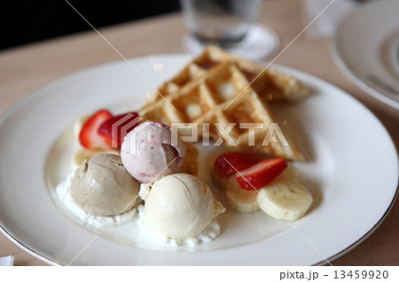 Waffles with ice cream and fruits 13459920