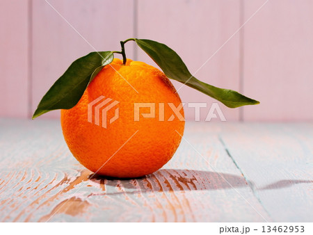 Ripe orange fruit with leaf on wooden board Ripe orange fruit with leaf on wooden board 13462953