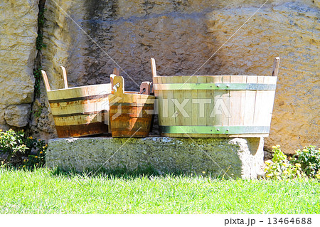 Wooden buckets and tubs in the courtyard of fortresses Guaita on 13464688