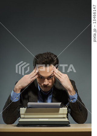 Inspired author working at the typewriter  13466147