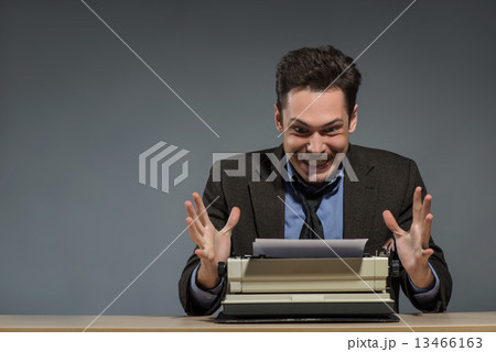 Inspired author working at the typewriter  13466163