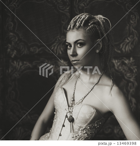 Freaky young female model wearing corset Freaky young female model wearing corset 13469398