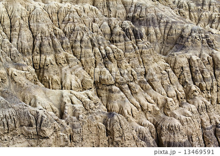 Crumbling sandy slopes close up as background Crumbling sandy slopes close up as background 13469591