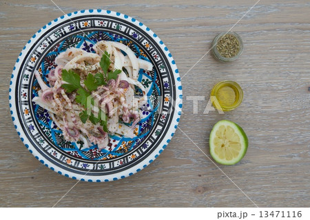 Marinated squid salad with fresh parsley Marinated squid salad with fresh parsley 13471116